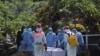 Petugas memakai baju hazmat dalam pemakaman Guru Besar UGM Prof Iwan Dwiprahasto di Makam Sawitsari Yogyakarta, Selasa, 24 Maret 2020. (Foto: Courtesy/Humas UGM)