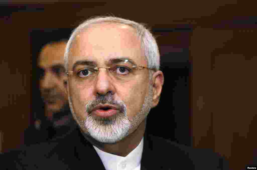 Iranian Foreign Minister Mohammad Javad Zarif reacts as he talks with reporters before meeting with U.S. Secretary of State John Kerry saying that his meeting with Kerry is important to see if progress could be made in narrowing differences on his country's disputed nuclear program, in Geneva, Jan. 14, 2015.