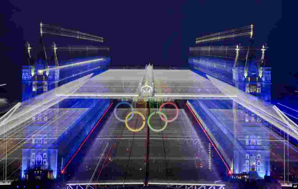 The iconic Tower Bridge over the River Thames in central London, decorated with Olympic rings, during the Opening Ceremony at the 2012 Summer Olympics, July 27, 2012, in London.