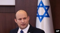 Israeli Prime Minister Naftali Bennett chairs the first weekly Cabinet meeting of the new government in Jerusalem, June 20, 2021. 
