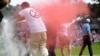 Climate protesters run onto green, spray powder, delaying finish of PGA Tour event 