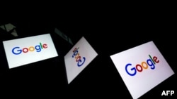 FILE - This illustration photo taken Feb. 18, 2019, shows the US multinational technology and Internet-related services company Google logo displayed on a tablet in Paris.