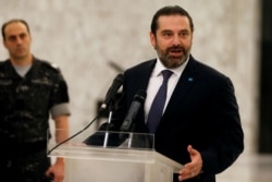 FILE - Saad Hariri speaks after meeting President Michel Aoun at the presidential palace in Baabda, Lebanon, Nov. 7, 2019.