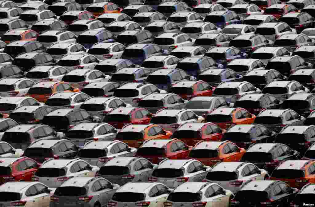 Newly manufactured cars of the automobile maker Subaru await export in a port in Yokohama, Japan.