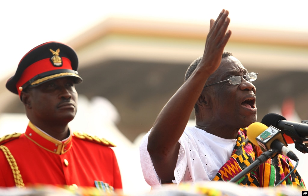 Ghana's President John Atta Mills, right, gestures as he speaks after being sworn in as the country's new president during a ceremony in Accra, Ghana, January 7, 2009.