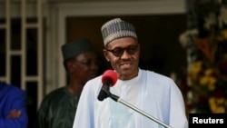 FILE - Nigeria's President Muhammadu Buhari speaks during a news conference after the Summit of Heads of State and Government of The Lake Chad Basin Commission (LCBC) in Abuja, Nigeria, June 11, 2015.