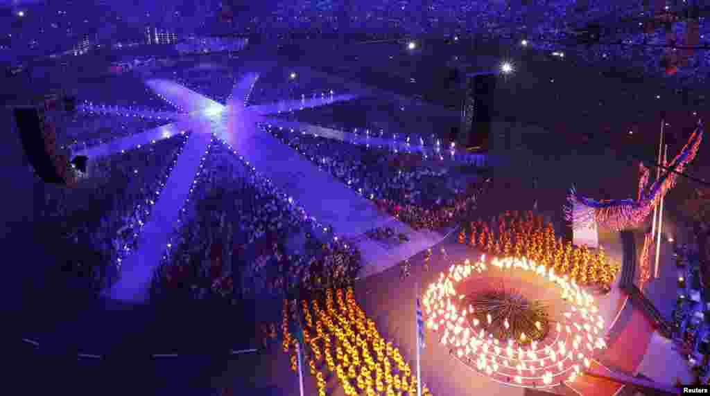 The Olympic Flame is being extinguished during the closing ceremony of the London 2012 Olympic Games at the Olympic Stadium August 12, 2012.