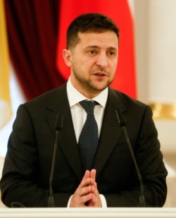 Ukrainian President Volodymyr Zelenskiy speaks during a press conference in Kyiv, Nov. 19, 2019.