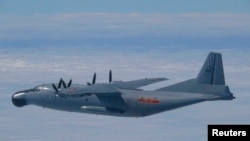 Chinese military Y-8 airborne early warning plane flies through airspace between Okinawa's main island and smaller Miyako island, southern Japan, Oct. 27, 2013.