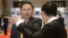 Cambodian business tycoon Ly Yong Phat, left, waits for Cambodia's Prime Minister Hun Sen to arrive for the Cambodia-China Business and Investment Forum at the outskirt of Phnom Penh, Cambodia, Thursday, Dec. 1, 2016. (AP Photo/Heng Sinith)