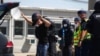 FILE - Austrian and Hungarian police officers attend an exercise to prevent migrants from crossing the Austrian border from Hungary in Nickelsdorf, Austria, July 2, 2020.