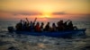 ARCHIVES - Des migrants tunisiens dans un bateau en bois à 16 miles à l'ouest de l'île italienne de Pantelleria dans la mer Méditerranée, le vendredi 5 août 2022.