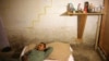 Toribio Jimenez lies on his bed in his basement bedroom of the home where he and 10 other people live in Nashville, Tenn, Sept. 3, 2009. Jimenez was given a job removing asbestos in the U.S. through the H2-B nonagricultural guest worker program. The job was not the job that was promised to him through the program, and after being fired, Jimenez said he now has no option but to work illegally so he can pay back the money he borrowed to make the trip to the U.S. 