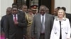Kenya's President Mwai Kibaki (C), flanked by U.S. Secretary of State Hillary Clinton (R) and his vice president Kalonzo Musyoka (L), leaves after a meeting at State House in Nairobi August 4, 2012. 