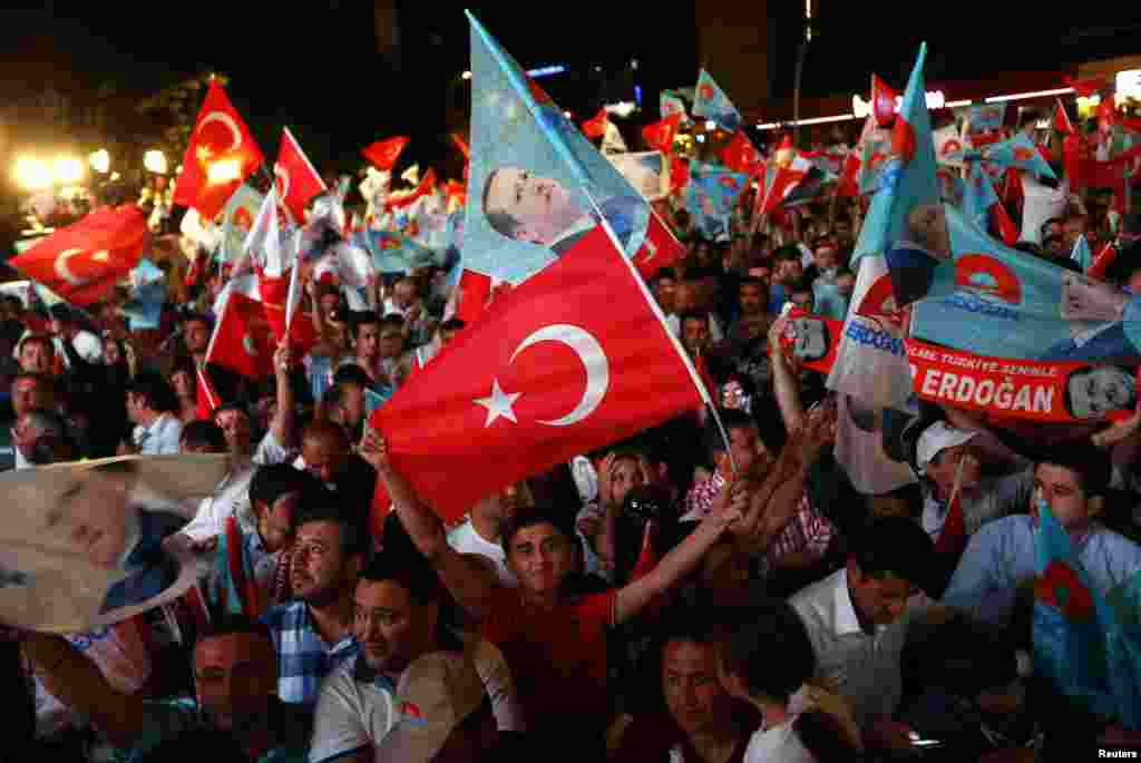 Supporters of Turkey's Prime Minister Tayyip Erdogan celebrate his election victory in front of the party headquarters, in Ankara, Aug. 10, 2014.