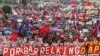 Protesters march to oppose Philippine President Benigno Aquino's fifth State of the Nation Address (SONA) during the joint session of the 16th Congress at the House of Representatives of the Philippines in Quezon city, Metro Manila, July 28, 2014. 