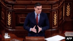 Spanish Prime Minister Pedro Sanchez delivers a speech during a session at the Lower Chamber of the Spanish Parliament in Madrid on April 22, 2020. - Spain has suffered the world's third-most deadly outbreak of the coronavirus, which has so far…