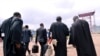 Les avocats quittent la prison de Makala à Kinshasa à la fin du procès en appel des assassins du militant Floribert Chebeya, le 27 novembre 2012, devant un tribunal militaire. (Photo: Junior D. Kannah / AFP)