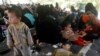 Suspected migrants being detained at a rubber plantation in Hat Yai district of Songkhla province southern Thailand Thursday, March 13, 2014. 