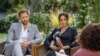 El príncipe Enrique de Gran Bretaña y su esposa Meghan Markle durante una entrevista de la presentadora estadounidense Oprah Winfrey.