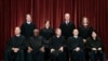 In April 23, 2021, photo, Supreme Court members pose for a group photo. Seated from left: Samuel Alito, Clarence Thomas, John Roberts, Stephen Breyer and Sonia Sotomayor. Standing from left: Brett Kavanaugh, Elena Kagan, Neil Gorsuch, Amy Coney Barrett.