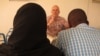 UNICEF's Grev Lester Hunt meets with Ebola survivors who are forming a support group in Conakry, Guinea, on Sept. 29, 2014. 