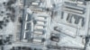 This handout satellite image released by Maxar Technologies shows a close up of armored personnel carriers and trucks at Russia's Klimovo storage facility, in Bryansk Oblast, 13 kilometers north of the Russia/Ukraine border, Jan. 19, 2022.