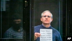 Paul Whelan, a former U.S. marine who was arrested for alleged spying, listens to the verdict in a courtroom at the Moscow City Court in Moscow, Russia, June 15, 2020. 