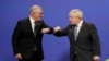 FILE - Britain's Prime Minister Boris Johnson greets Australia's Prime Minister Scott Morrison at the COP26 climate conference in Glasgow, Scotland, Nov. 1, 2021. On Feb. 16, 2022, Britain committed $34 million to strengthen Indo-Pacific security.