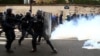 French riot police take position during clashes with French ambulance drivers as part of a demonstration at the Place de la Concorde in Paris, France, Dec. 3, 2018.