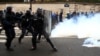 French riot police take position during clashes with French ambulance drivers as part of a demonstration at the Place de la Concorde in Paris, France, Dec. 3, 2018.