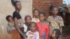 Neema, a DRC refugee says in the absence of WFP food aid she feels her family of 8 children is 'buried alive'. (Lameck Masina/VOA)