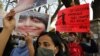 People hold placards demanding the release of Indian climate activist Disha Ravi, during a protest in Bengaluru, India, Feb.15 2021.