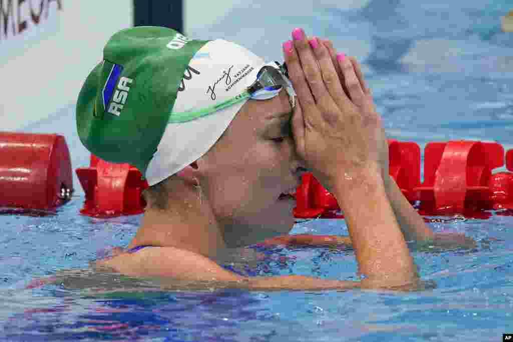 Tatjana Schoenmaker, of South Africa, reacts after a heat during the women's 100-meter breaststroke at the 2020 Summer Olympics, Sunday, July 25, 2021, in Tokyo, Japan. (AP Photo/Charlie Riedel)