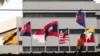 FILE - Flags of member countries fly at the ASEAN Secretariat in Jakarta, Indonesia, April 22, 2021. Southeast Asia's top diplomats will discuss in an emergency meeting today ​whether to allow Myanmar's military leader to attend an annual summit.