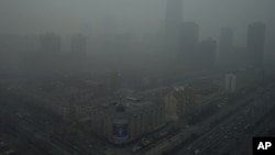 Skyscrapers are obscure by heavy haze in Beijing, China, January 13, 2013. 