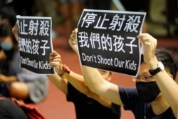 Residents of Tsuen Wan gather at an open air stadium, Oct. 2, 2019, to protest a teenage demonstrator shot at close range in the chest by a police officer in Hong Kong.