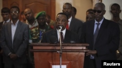 UN special envoy for Somalia Augustine Mahiga. center (file photo, AU-UN via Reuters).