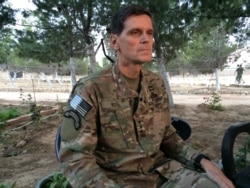 FILE - Army Gen. Joseph Votel speaks to reporters during a trip to Syria, May 21, 2016.
