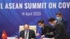 Vietnamese Prime Minister Nguyen Xuan Phuc, left, and his staff prepare documents ahead of the Special ASEAN summit on COVID-19 in Hanoi, Vietnam Tuesday, April 14, 2020. ASEAN leaders and their counterparts from China, Japan and South Korea hold…