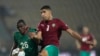 Morocco's Adam Masina, right, kicks the ball as he defends against Malawi's Stain Davie, during the African Cup of Nations 2022 round of 16 soccer match between Morocco and Malawi at the Ahmadou Ahidjo stadium in Yaounde, Cameroon, Jan. 25, 2022. 