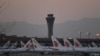 Air China planes are seen on the tarmac at Beijing Capital Airport in Beijing amid the ongoing COVID-19 coronavirus outbreak on March 13, 2020. - China reported just eight cases of the coronavirus on March 13, with no new domestic infections outside the e
