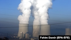 BOSNIA-HERZEGOVINA -- A general view of emissions rising from chimneys of a coal fired thermal power plant in Tuzla, December 12, 2018