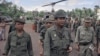 Lt. General Lon Nol, the Cambodian Prime Minister (foreground three stars) is followed by his high-command at the end of a visit they made to Skuon the task force headquarters in Cambodia on Sept. 23, 1973. The group made the fight to and from Phnom Penh via helicopters. (AP Photo/Max Nash)
