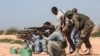 FILE - Ugandan instructors of African Union's peacekeeping mission in Somalia coach Somali soldiers during a training session in Ceeljaale, Somalia, Sept. 19, 2019. 