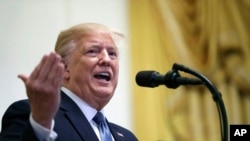 FILE - In this Oct. 4, 2019, photo, President Donald Trump speaks at the White House in Washington.