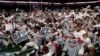 College Leaders Talk While Football Players Push to Play