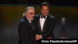 Leonardo DiCaprio, right, presents the lifetime achievement award to Robert De Niro at the 26th annual Screen Actors Guild Awards at the Shrine Auditorium & Expo Hall, Jan. 19, 2020, in Los Angeles.