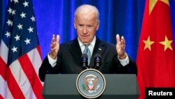 U.S Vice President Joe Biden gives a speech during his joint business leader breakfast at The St. Regis Beijing hotel in Beijing, Dec. 5, 2013.