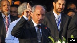 Pemimpin NTC, Mustafa Abdel Jalil mendeklarasikan bebasnya Libya dari rezim Gaddafi (23/12). AS dan Uni Eropa menyerukan pemerintahan sementara Libya melakukan rekonsiliasi.
